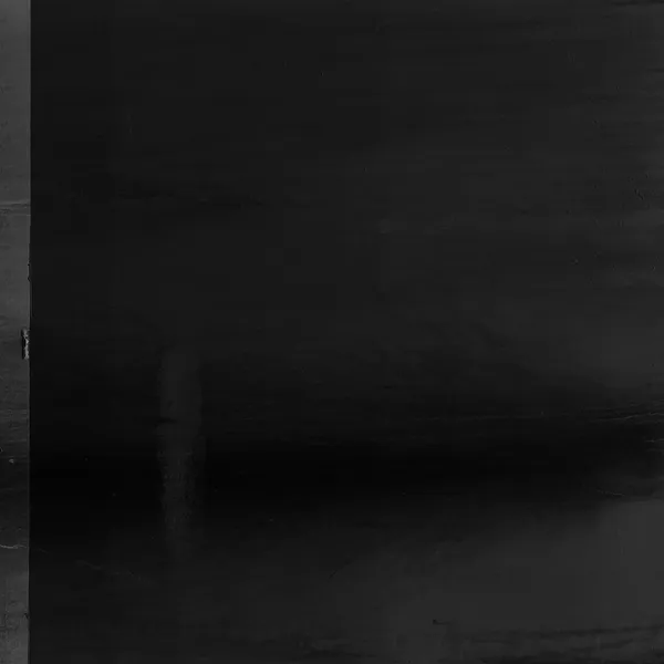 An almost entirely black seascape from Sète, the faintest hint of a pier dissolving into the darkness of sea and sky merging into one