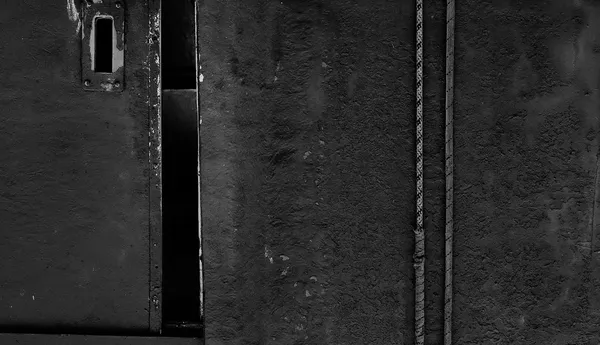 Three dark textured panels of weathered marine surfaces from the port of Sète, rust and salt composing a triptych of industrial decay